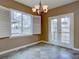 Dining room with slate tile flooring, a chandelier, and French doors at 5072 Meadow Mountain Dr, Broomfield, CO 80023