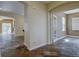 Spacious foyer with stylish tile flooring and views into the living spaces at 5072 Meadow Mountain Dr, Broomfield, CO 80023
