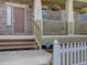 Close-up of a charming front porch with stone detailing and a welcoming entrance to the home at 5072 Meadow Mountain Dr, Broomfield, CO 80023