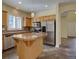 Spacious kitchen with stainless appliances, granite counters, and an island at 5072 Meadow Mountain Dr, Broomfield, CO 80023