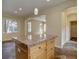Kitchen island with granite countertop and wooden cabinets, perfect for cooking at 5072 Meadow Mountain Dr, Broomfield, CO 80023