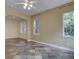 Bright living room area with slate tile floors and multiple windows for natural light at 5072 Meadow Mountain Dr, Broomfield, CO 80023