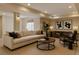 Cozy living room features a comfortable sofa, stylish decor, and ample natural light for relaxation at 5072 Meadow Mountain Dr, Broomfield, CO 80023