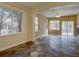 Spacious living room featuring large windows and slate tile flooring at 5072 Meadow Mountain Dr, Broomfield, CO 80023