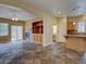 Open-concept living area with slate tile flooring, built-in shelves, and a fireplace at 5072 Meadow Mountain Dr, Broomfield, CO 80023