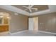 This main bedroom features access to the bathroom, and a neutral color palette at 5072 Meadow Mountain Dr, Broomfield, CO 80023