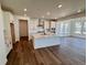 Bright, modern kitchen featuring white cabinetry, stainless steel appliances, and an island at 4609 Thistle Dr, Brighton, CO 80601