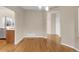 Bright dining room featuring beautiful hardwood floors and archway leading to additional rooms at 110 Gold Maple St, Brighton, CO 80601