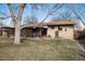 Expansive backyard with a charming covered patio, perfect for outdoor dining and relaxation at 2993 S Zenobia St, Denver, CO 80236