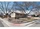 A ranch style home situated on a corner lot, adorned with mature trees at 2993 S Zenobia St, Denver, CO 80236