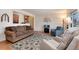 Comfortable living room featuring hardwood floors, neutral decor, and plenty of natural light at 2993 S Zenobia St, Denver, CO 80236