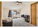 Cozy bedroom with closet, window and ceiling fan at 12053 E Tennessee Ave, Aurora, CO 80012