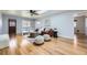 Cozy living room with skylight, wood floors, stylish furniture, and natural light at 1280 S Quitman St, Denver, CO 80219