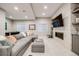Inviting basement with comfortable seating, fireplace, and entertainment features at 10590 Soulmark Way, Highlands Ranch, CO 80126