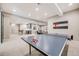 Spacious finished basement with bar, ping pong table, and lounge area at 10590 Soulmark Way, Highlands Ranch, CO 80126