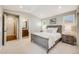 Bright bedroom with a spacious layout, ensuite bathroom and modern neutral décor at 10590 Soulmark Way, Highlands Ranch, CO 80126