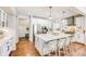 Bright kitchen with large center island, stainless appliances and breakfast bar seating at 10590 Soulmark Way, Highlands Ranch, CO 80126