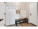 Mudroom area with coat hooks, a bench, and neutral décor, providing a practical entryway at 10590 Soulmark Way, Highlands Ranch, CO 80126