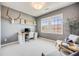 Bright home office with a large window, contemporary decor, and a functional workspace at 10590 Soulmark Way, Highlands Ranch, CO 80126