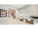 Bright office space with built-in desk and view of basement game room at 10590 Soulmark Way, Highlands Ranch, CO 80126