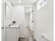 Bathroom view showcasing the sink, vanity, and doorway to the carpeted bedroom at 1665 Boston St, Aurora, CO 80010