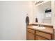 Half bathroom with modern sink, vanity and neutral paint at 2139 Coronado Pkwy # B, Denver, CO 80229