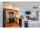 Open kitchen with stainless appliances and an opening through to the Gathering room at 2139 Coronado Pkwy # B, Denver, CO 80229