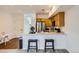 Modern kitchen that is open to the Gathering room area with counter seating at 2139 Coronado Pkwy # B, Denver, CO 80229