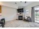 Cozy living room area featuring a stone fireplace and sliding glass door at 2139 Coronado Pkwy # B, Denver, CO 80229