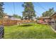 A well-manicured backyard with a trampoline and a deck, perfect for outdoor activities and relaxing at 555 W Mansfield Ave, Englewood, CO 80110