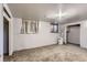 Finished basement offers flexible space, carpeting, a window for natural light, and a closet at 555 W Mansfield Ave, Englewood, CO 80110