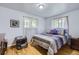 Cozy bedroom with hardwood floors and bright natural light at 555 W Mansfield Ave, Englewood, CO 80110