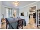 Well-lit dining room with hardwood floors and access to patio at 555 W Mansfield Ave, Englewood, CO 80110