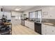 Well-maintained kitchen with updated appliances and granite countertops at 555 W Mansfield Ave, Englewood, CO 80110