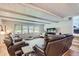 Spacious living room featuring beamed ceilings and large windows at 555 W Mansfield Ave, Englewood, CO 80110