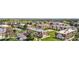 Wide aerial shot showcases a charming community, featuring well-maintained green spaces and convenient parking areas at 10211 Ura Ln # 1-202, Thornton, CO 80260