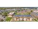 Extensive aerial shot of a well-planned community with orderly apartment buildings and verdant landscaped lawns at 10211 Ura Ln # 1-202, Thornton, CO 80260