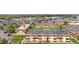 Wide aerial shot of the condo community near commercial areas and parking at 10211 Ura Ln # 1-202, Thornton, CO 80260