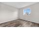 Well lit, empty bedroom with bright windows and sleek flooring at 10211 Ura Ln # 1-202, Thornton, CO 80260