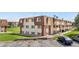 Exterior shot of well-maintained apartment buildings with ample parking and manicured lawns, creating a welcoming community atmosphere at 10211 Ura Ln # 1-202, Thornton, CO 80260