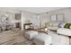 Bright living room with dining area featuring modern decor, neutral colors, and ample space at 10211 Ura Ln # 1-202, Thornton, CO 80260