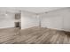 Spacious living room featuring modern flooring, neutral walls, and ample natural light at 10211 Ura Ln # 1-202, Thornton, CO 80260