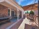 Well maintained back deck with brick detail, outdoor furniture, and a large patio umbrella at 5231 S Cody St, Littleton, CO 80123