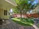 Lush backyard featuring a covered patio, deck, and well-maintained landscaping, ideal for outdoor enjoyment at 5231 S Cody St, Littleton, CO 80123