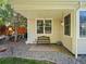 A cozy backyard patio area with bench seating, perfect for relaxing and enjoying the outdoors at 5231 S Cody St, Littleton, CO 80123