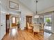 The dining room offers hardwood floors, a light fixture, and a sliding door to access the outdoor area at 5231 S Cody St, Littleton, CO 80123