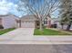 Beautiful single-Gathering home featuring a well-manicured lawn and two-car garage at 5231 S Cody St, Littleton, CO 80123