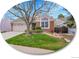 Charming brick home featuring a well-maintained front yard and a large arched window at 5231 S Cody St, Littleton, CO 80123