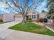 Charming home with brick accents, a lush front lawn, and a two-car garage at 5231 S Cody St, Littleton, CO 80123