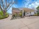 Governor's Hall features manicured landscaping, brick accents, and a covered entrance for a welcoming curb appeal at 5231 S Cody St, Littleton, CO 80123